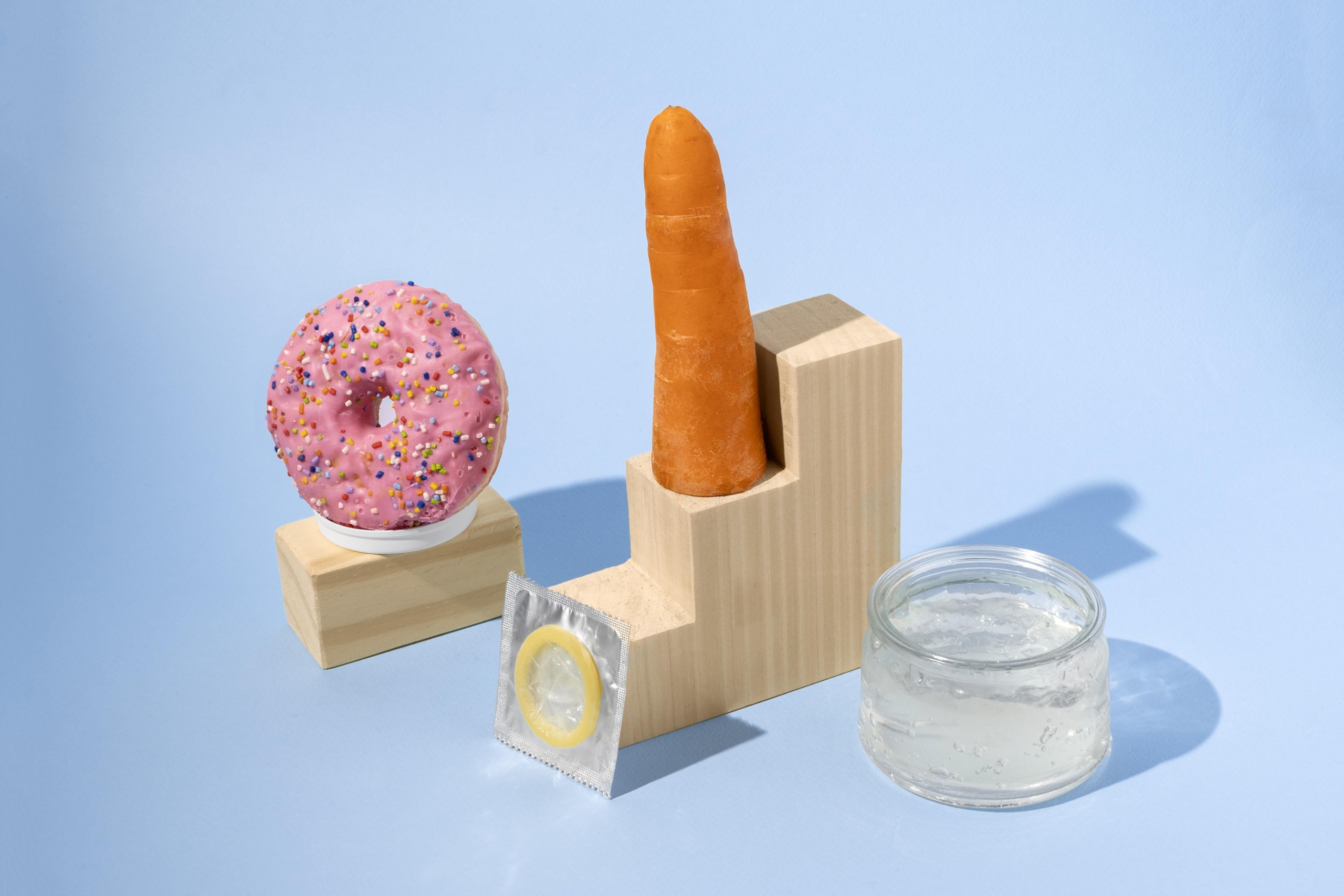 abstract sexual health assortment with food ilsutrating How to introduce sex toys to your partner